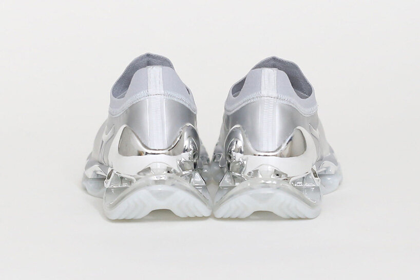 hajime sorayama re-envisions mizuno's wave prophecy silhouette