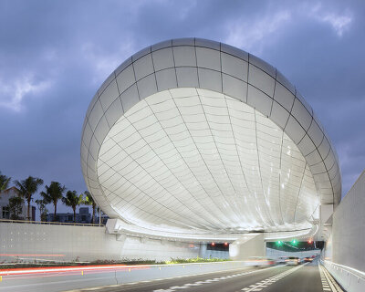 penda china's three sculptural tunnel portals add 'tinge of surrealism' to haikou