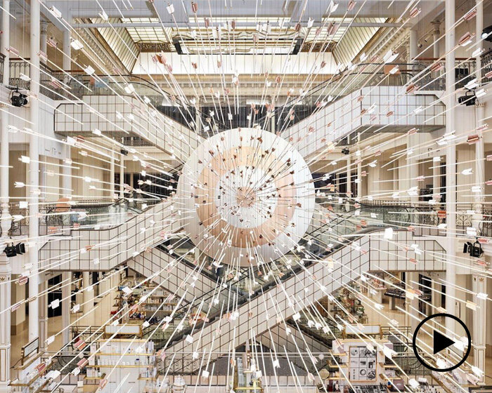 prune nourry installs cloud of 888 flying arrows inside le bon marché in paris
