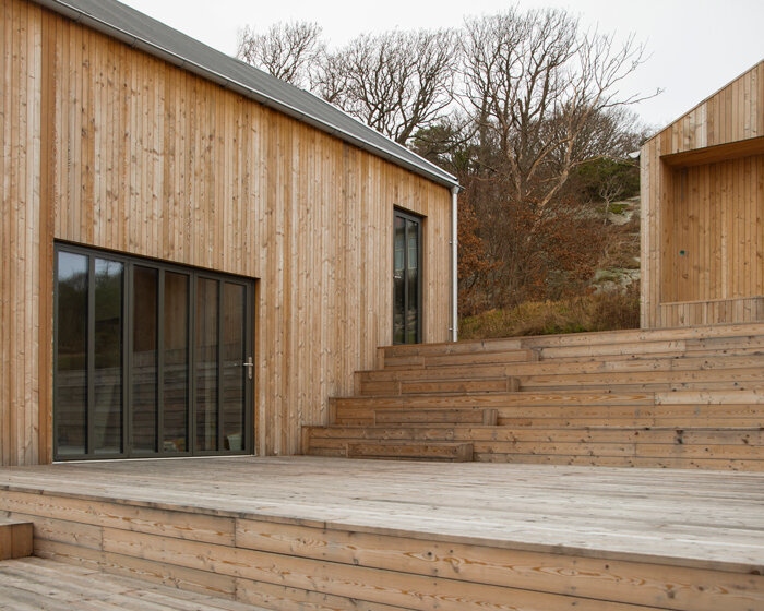 with its archipelago house, NORM architects wraps the coast of sweden in timber