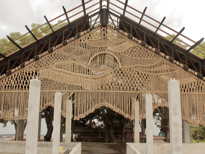 agnes hansella hangs massive macramé wall trio on a seaside structure in bali