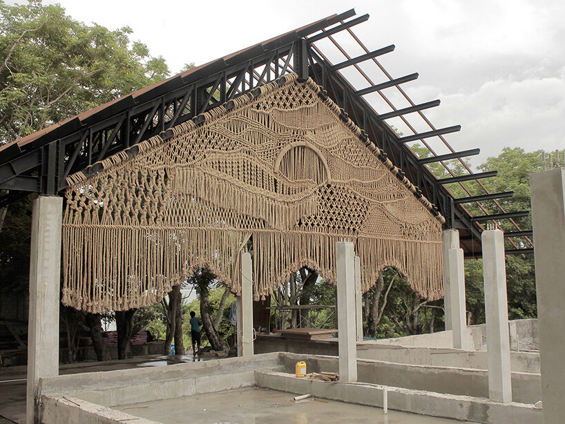 agnes hansella hangs massive macramé wall trio on a seaside structure in bali