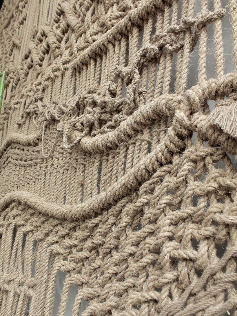 agnes hansella hangs massive macramé wall trio on a seaside structure in bali