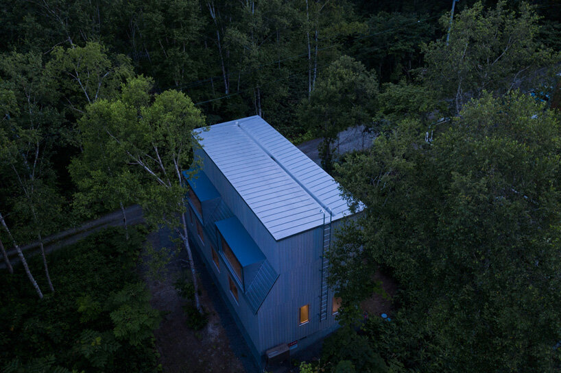 CASE-REAL blends 'chalet W' into the wooded landscape of japan's niseko ski resort