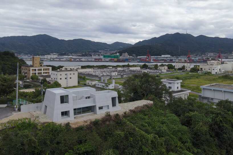 kazunori fujimoto architects builds fort-like house in japan with thick concrete exterior