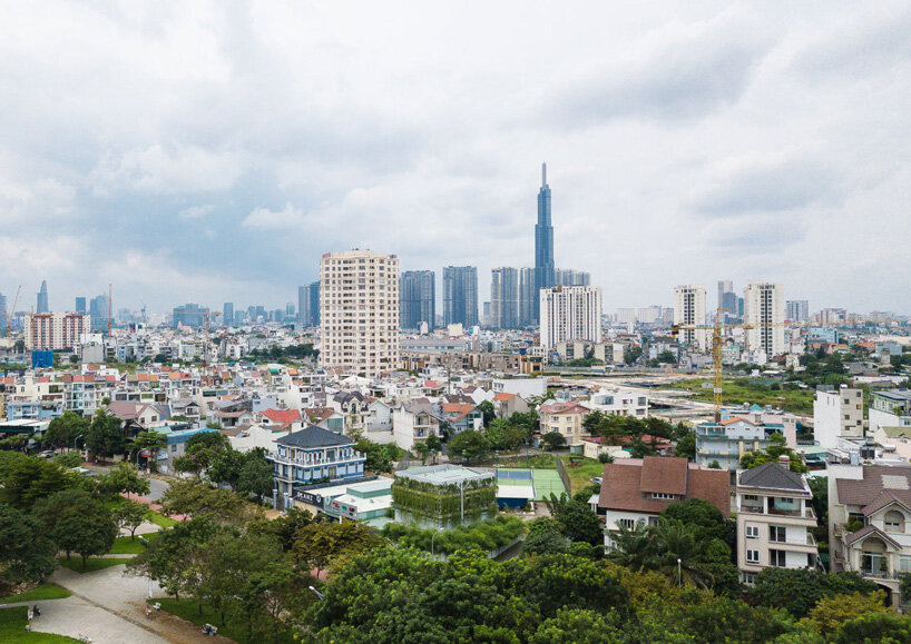 MIA design studio builds own office in vietnam as open plan volume wrapped in greenery