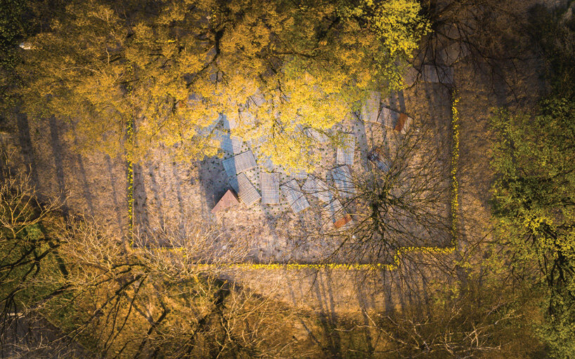 gray sandstone slabs compose NArchitekTURA's great synagogue memorial park in poland