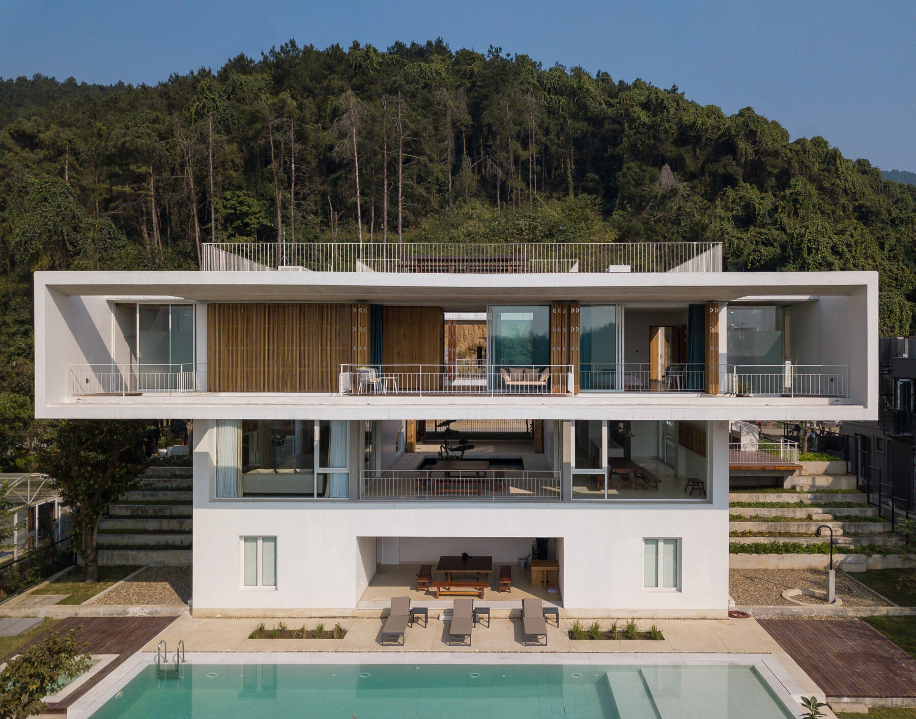 tropical space designs square-shaped 'tam dao villa' around open atrium in vietnam - 6