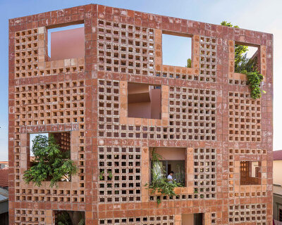 VTN architects wraps its bat trang house in a ceramic facade to celebrate its pottery village