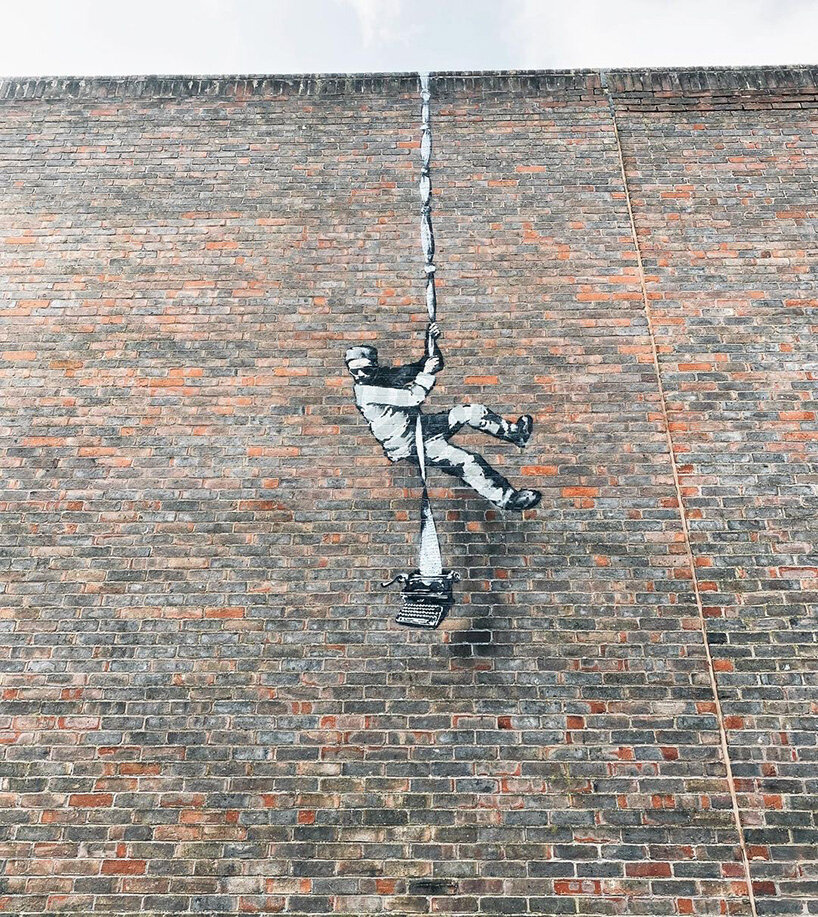 a suspected banksy mural has appeared on the walls of a prison in reading, england