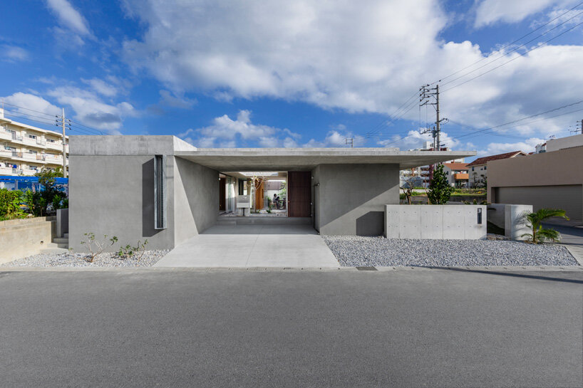 studio cochi architects develops concrete house around central open courtyard in japan