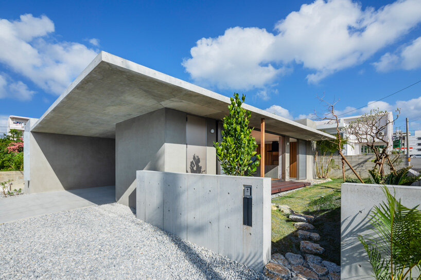 studio cochi architects develops concrete house around central open courtyard in japan
