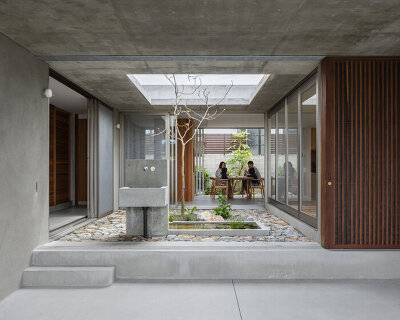 studio cochi architects develops concrete house around central open courtyard in japan