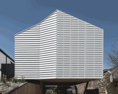 operable façade clads 'pop-up house' by figr architecture studio in australia
