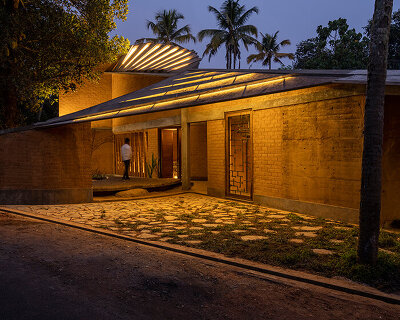 wallmakers designs its jackfruit garden residence as a twisting continuous surface