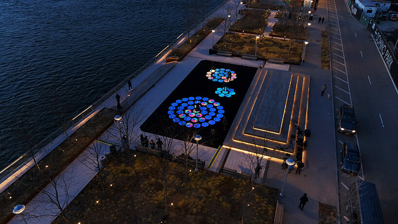 jen lewin installs reflect, an interactive light installation at brooklyn's domino park