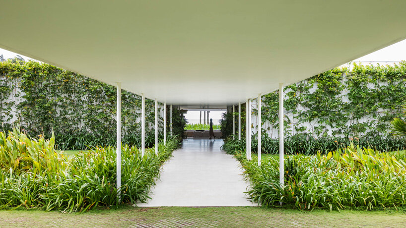 MIA design studio's thanh long bay gallery frames panoramic views of the ocean in vietnam