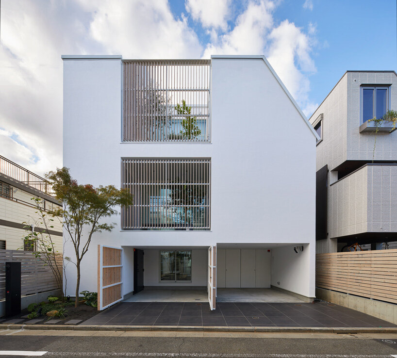 naf architect & design inserts glass courtyard in the center of this tokyo house
