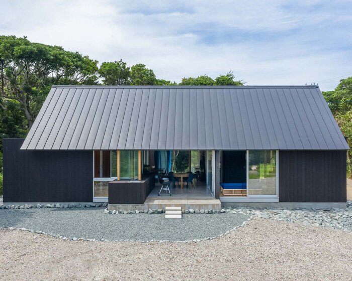 nanometer architecture wraps japanese house in charred timber cladding