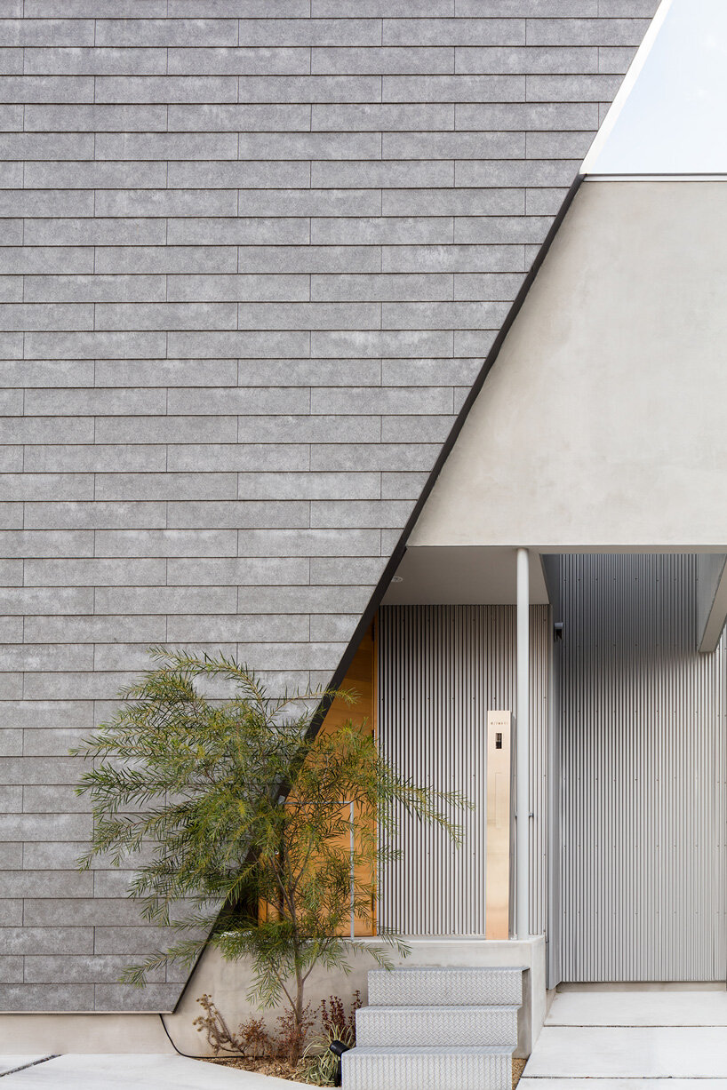 SAI architectural design office adds trapezoid front to house in osaka