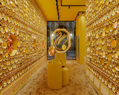 swarovski unveils an updated swan logo & new concept store