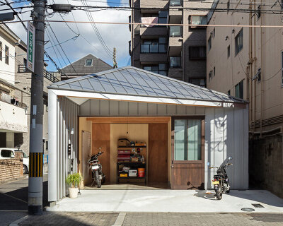 YYAA inserts steel-clad 'toolbox house' on a long, narrow plot in osaka, japan