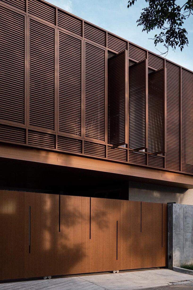 TOUCH architect conceals private courtyard behind louver façade in this house in thailand