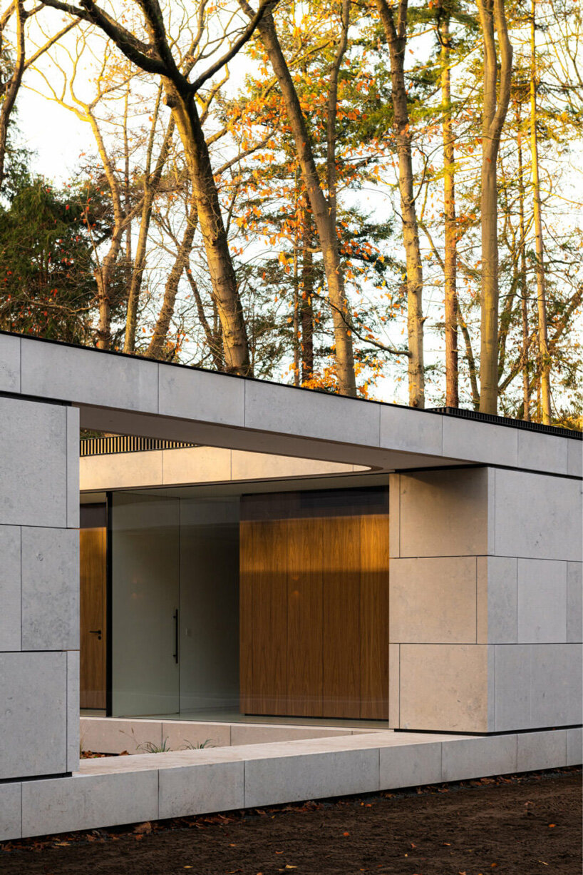 powerhouse company completes linear stone villa in the netherlands with central courtyard