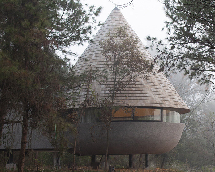 ZJJZ tops 'the mushroom' guest house with cone-shaped roof in china's jiangxi forest