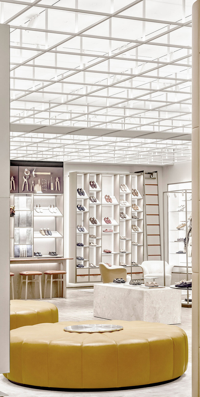 curiosity designs tod's studios in milan as an ever-changing gallery covered in travertine