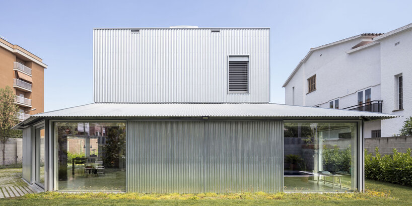 harquitectes surrounds metal-clad house 905 with wide veranda in spain