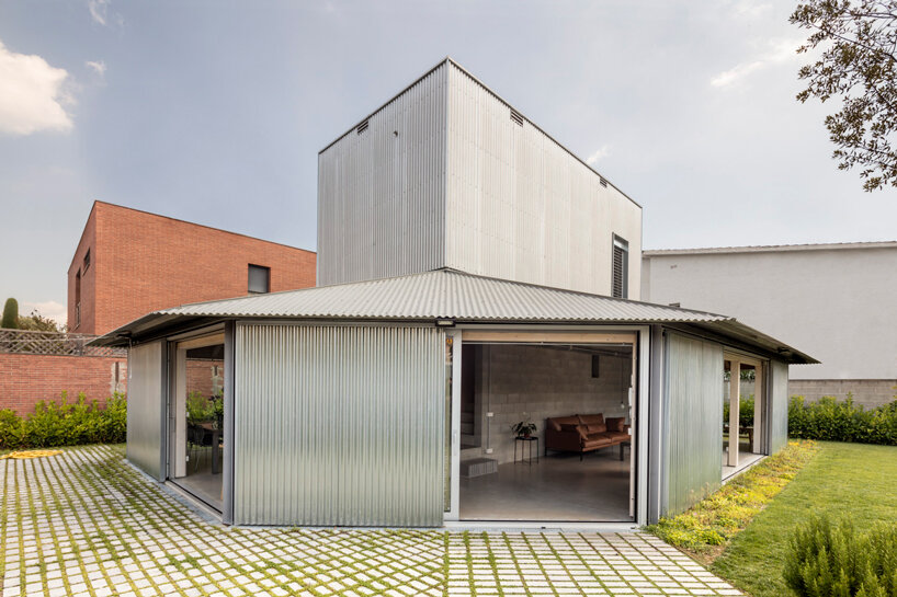 harquitectes surrounds metal-clad house 905 with wide veranda in spain