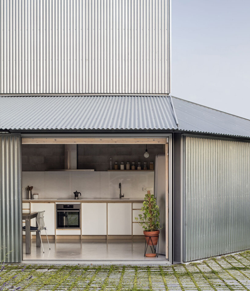 harquitectes surrounds metal-clad house 905 with wide veranda in spain