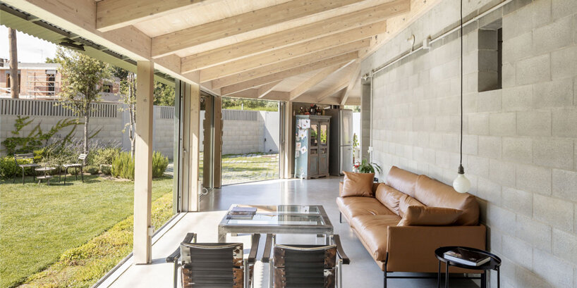 harquitectes surrounds metal-clad house 905 with wide veranda in spain