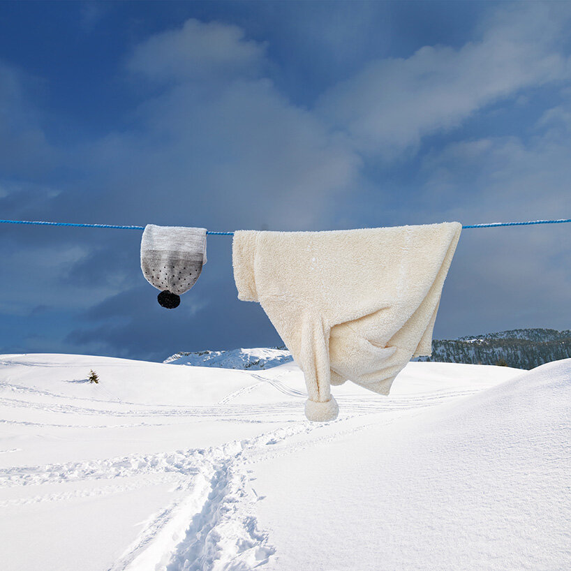 helga stentzel hangs a clothes polar bear to raise awareness on climate change