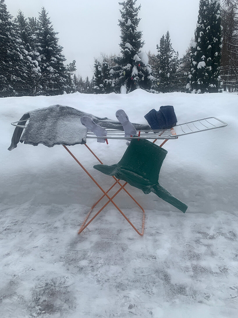 helga stentzel hangs a clothes polar bear to raise awareness on climate change