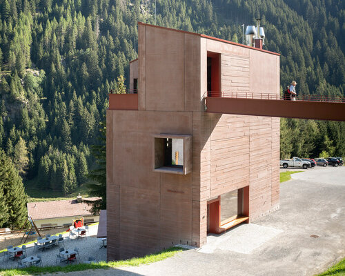 ibex museum st. leonhard echoes historic timber farmhouses with red concrete