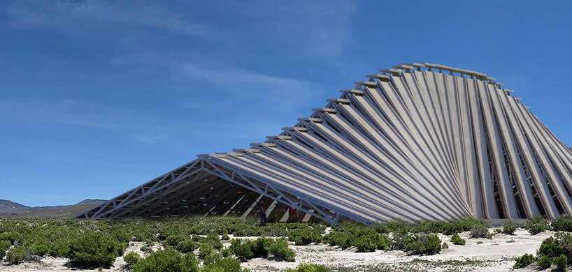 NUDES plans an undulating 'solar mountain' for burning man's fly ranch designboom