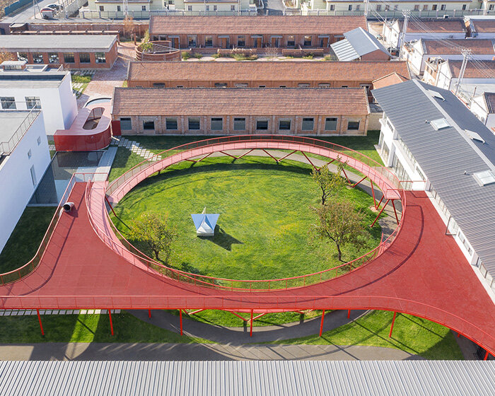 playful red platform encircles renovated youth activity center in china