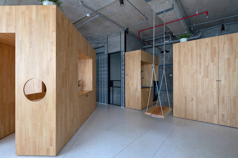 tropical space adds multipurpose wooden box for children in the center of this vietnam house