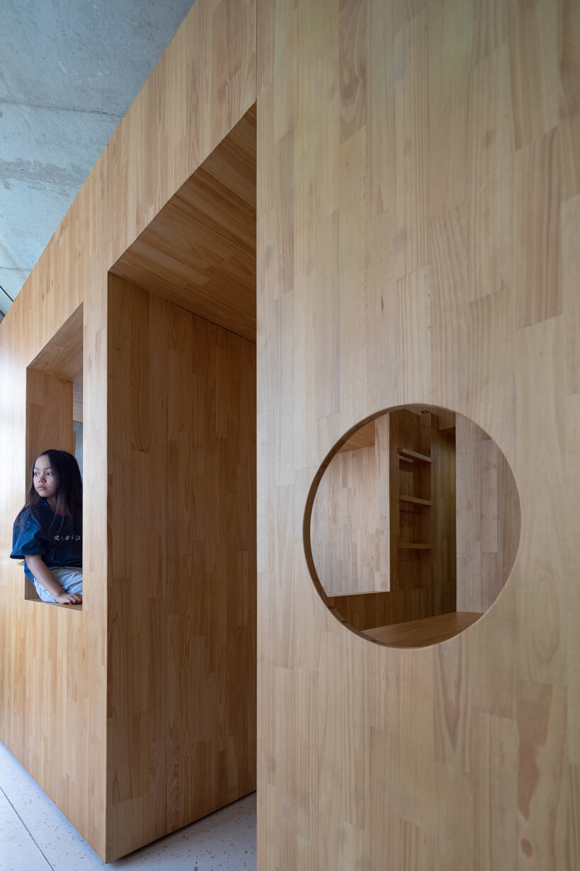 tropical space adds multipurpose wooden box for children in the center of this vietnam house