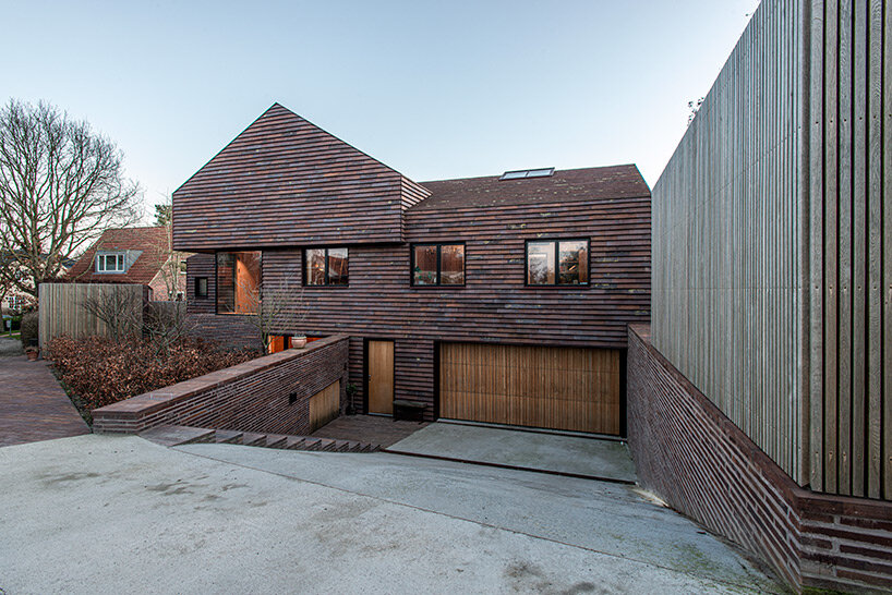 C.F. møller merges small brick-clad houses with gable roofs into 'villa E' in denmark