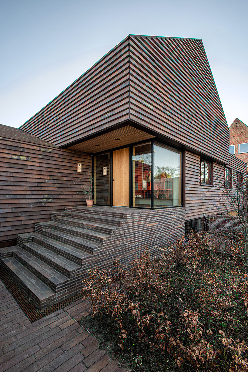 C.F. møller merges small brick-clad houses with gable roofs into 'villa E' in denmark