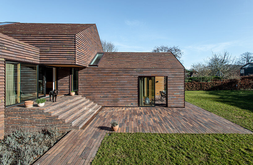 C.F. møller merges small brick-clad houses with gable roofs into 'villa E' in denmark