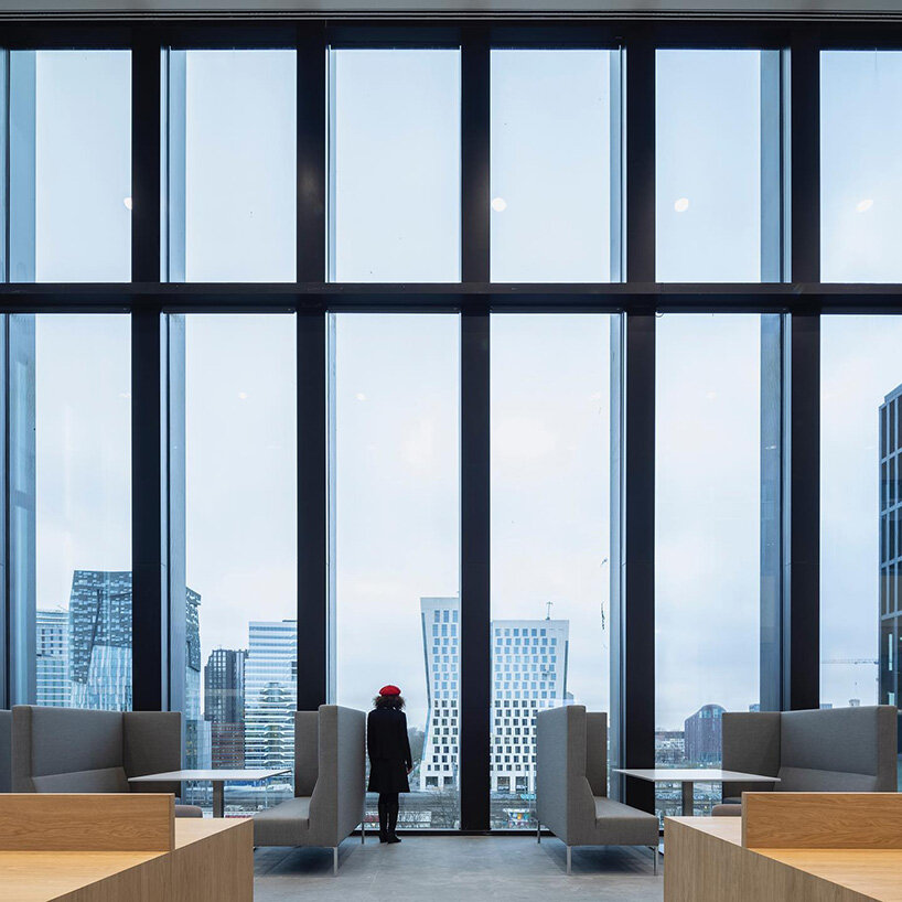 grand circular staircase spirals in the largest courthouse by KAAN architecten in amsterdam