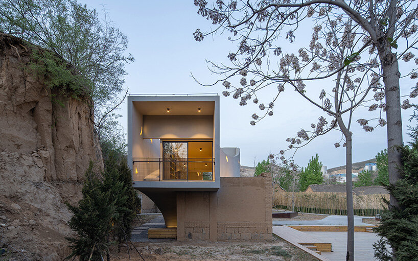atelier xi's sculptural library emerges from ruins in old chinese village