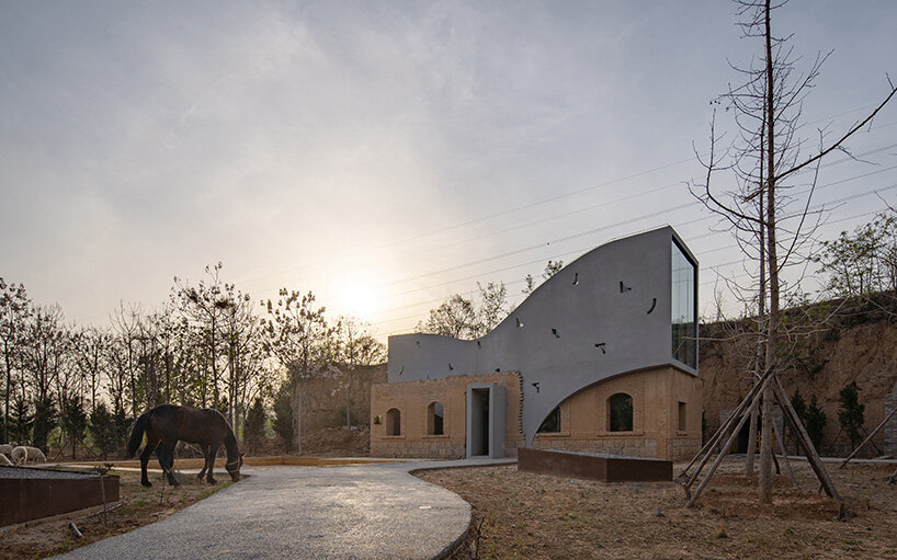 atelier xi's sculptural library emerges from ruins in old chinese village