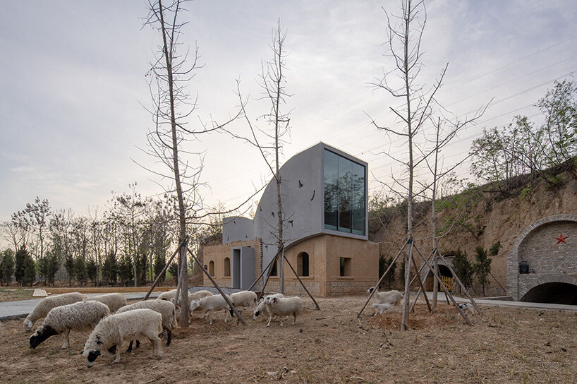 atelier xi's sculptural library emerges from ruins in old chinese village