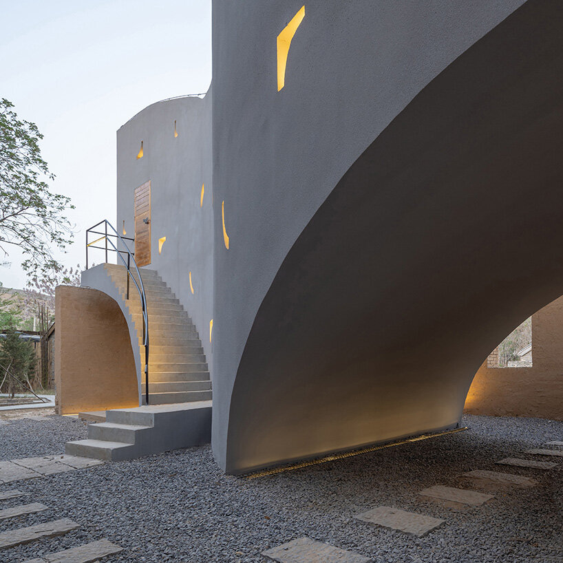 atelier xi's sculptural library emerges from ruins in old chinese village