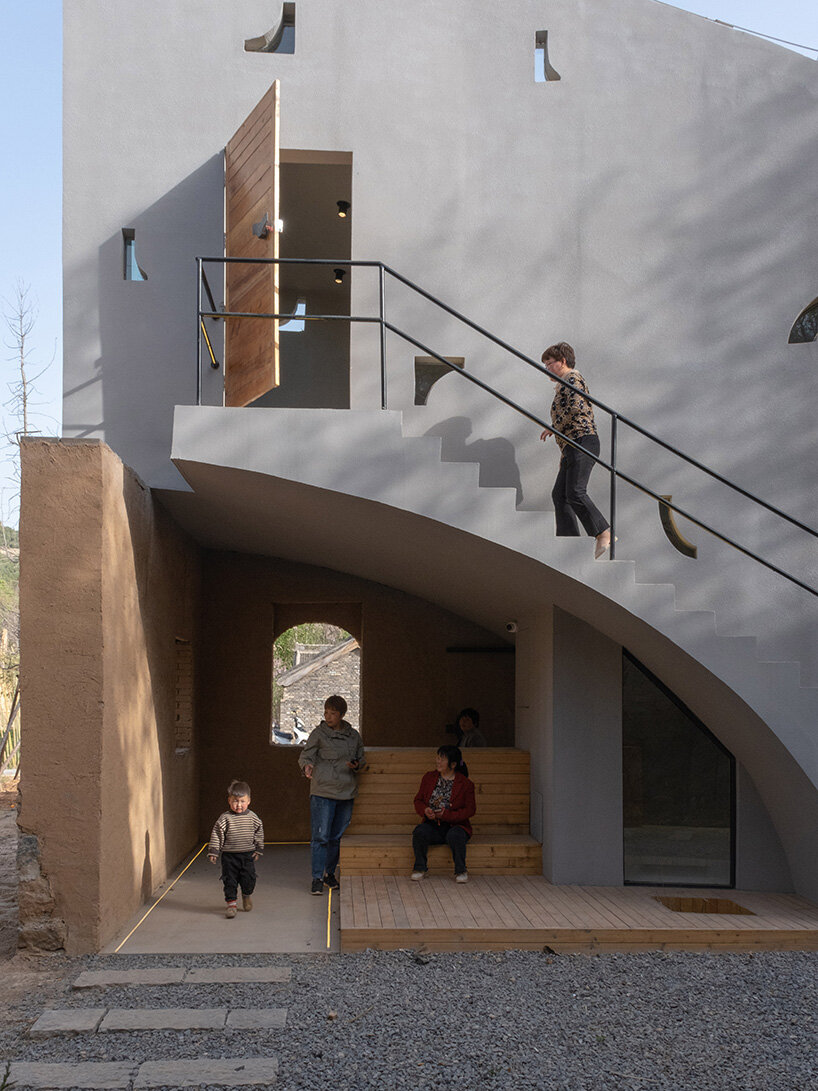 atelier xi's sculptural library emerges from ruins in old chinese village
